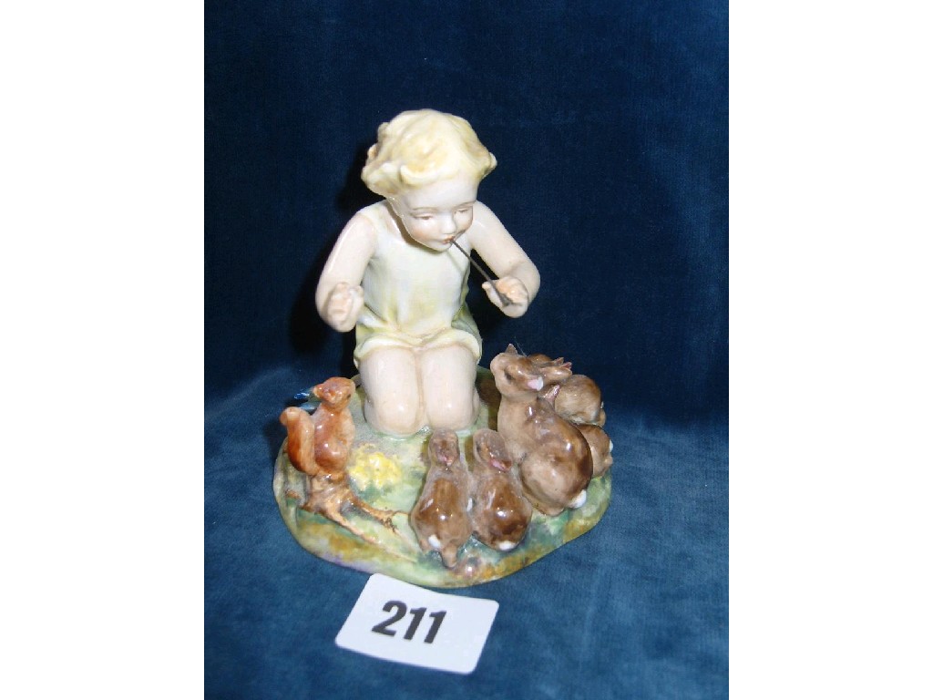 Appraisal: A Royal Worcester model of a child surrounded by rabbits