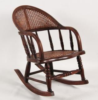 Appraisal: AMERICAN WALNUT CANE BACK AND SEAT CHILD'S ROCKER AMERICAN WALNUT