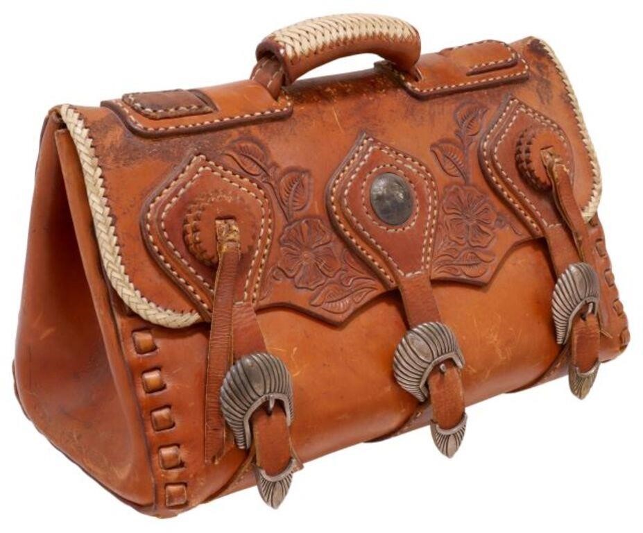 Appraisal: Vintage tooled leather travel bag with contrasting stitching Silver Peace