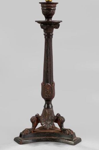 Appraisal: French Bronze-Patinated Cast-Iron Tripodal Candlestick second quarter th century in