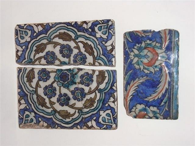 Appraisal: A TH CENTURY IZNIK SQUARE TILE with stylised flowerhead design