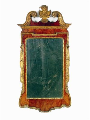 Appraisal: An th century walnut parcel giltwood and gesso wall mirror