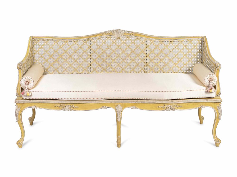 Appraisal: A Louis XV Style Caned and Cream-Painted Settee Height x