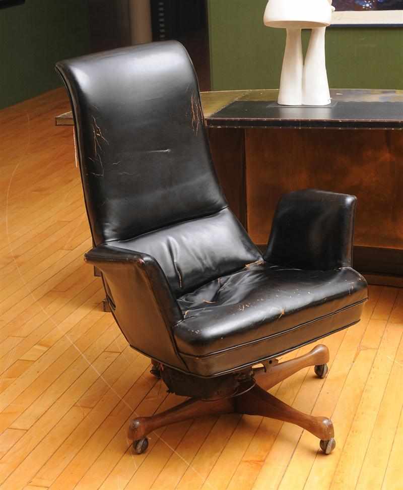 Appraisal: VLADIMIR KAGAN b LEATHER-UPHOLSTERED DESK CHAIR The sculpted one-piece shell