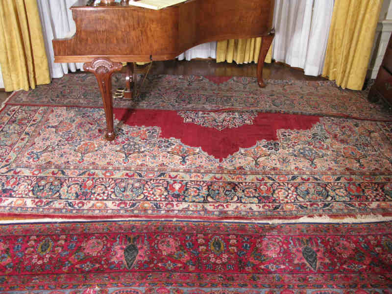 Appraisal: Persian Room Size Rug Kerman with deep wine red field