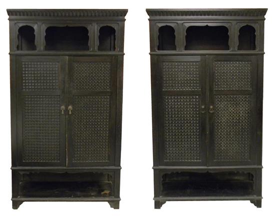 Appraisal: Pair Moroccan ebonized cupboards cornice carved with modified egg dart