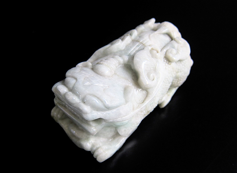 Appraisal: CARVED GREEN JADE CHINESE FOO DOG in a crouched position