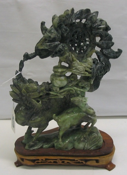 Appraisal: A CHINESE JADE FIGURAL GROUP of a decorative display of