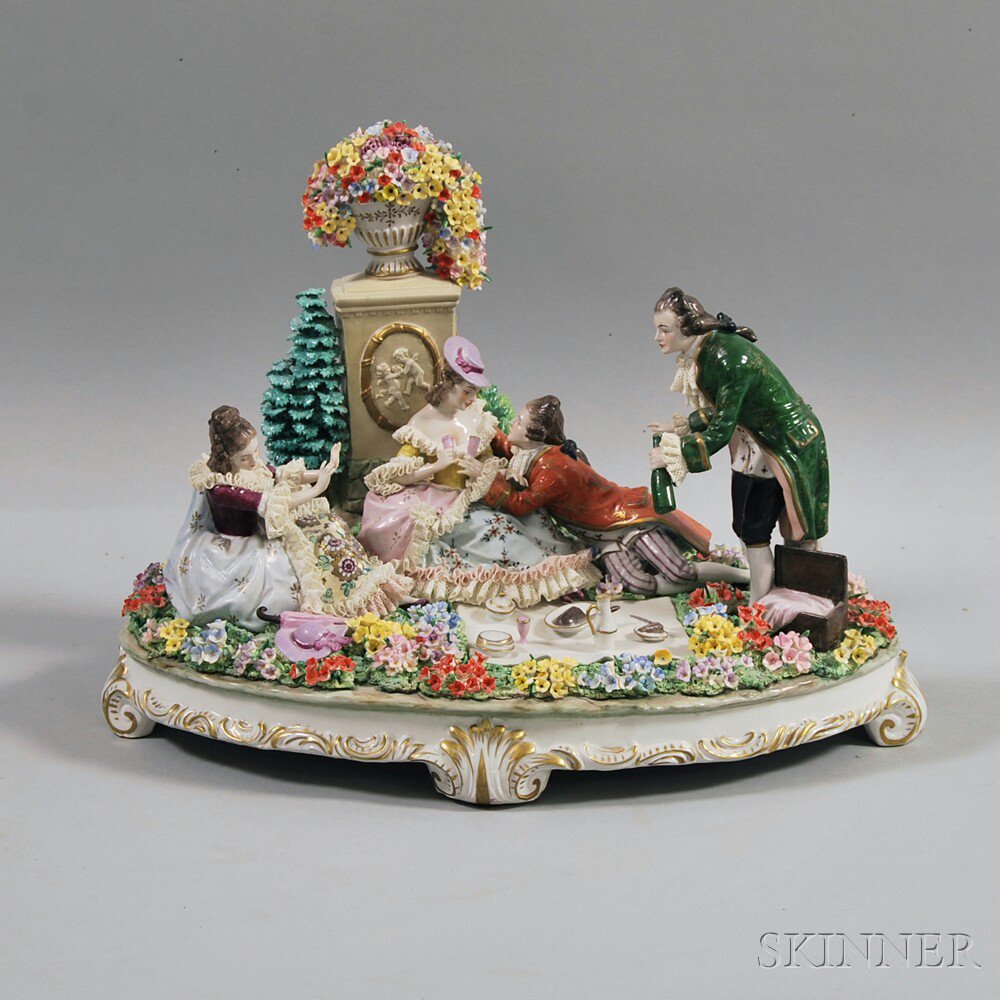 Appraisal: German Porcelain Figural Plateau th century depicting a picnicking scene