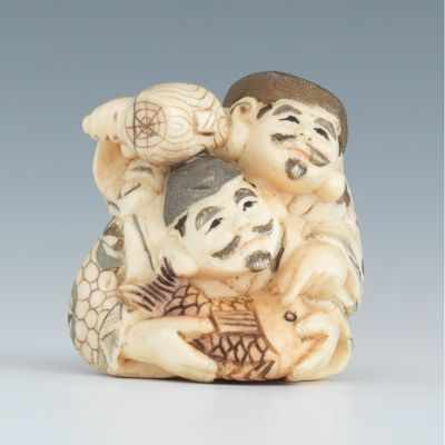 Appraisal: A Carved Ivory Netsuke of Fishermen Carved ivory netsuke depicting