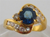 Appraisal: A sapphire and diamond ring the central sapphire x x