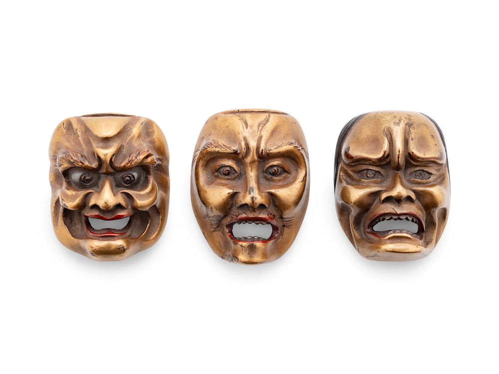 Appraisal: Three Gilt Lacquered Wood Mask Netsukes Three Gilt Lacquered Wood