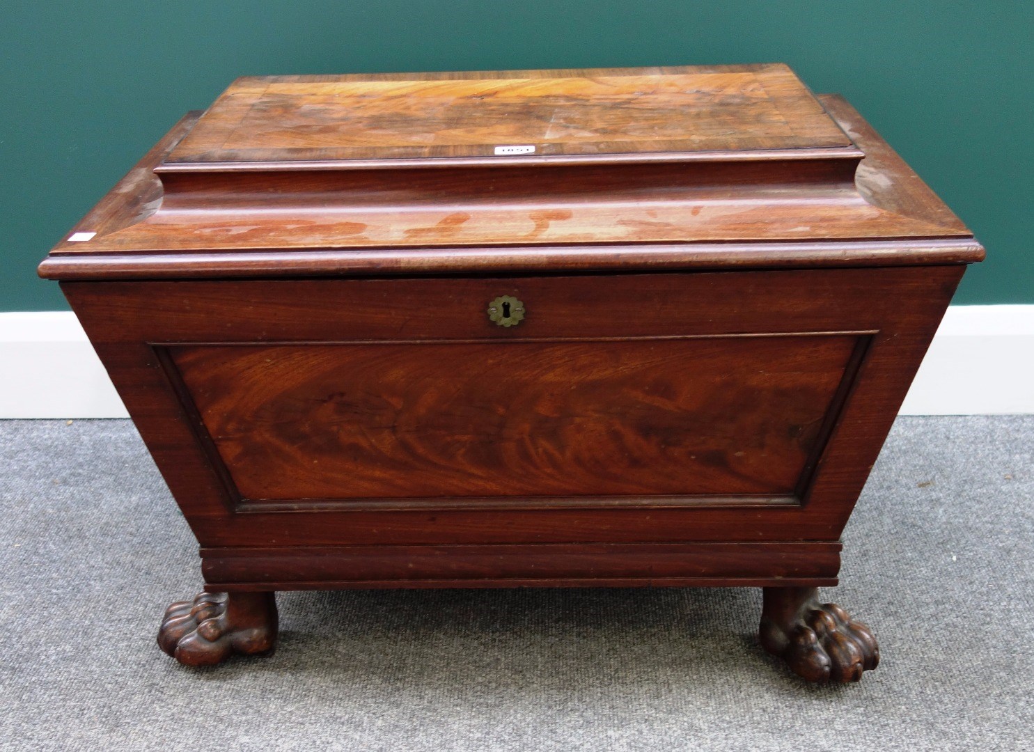 Appraisal: A Regency mahogany cellerette of sarcophagus form on lions paw