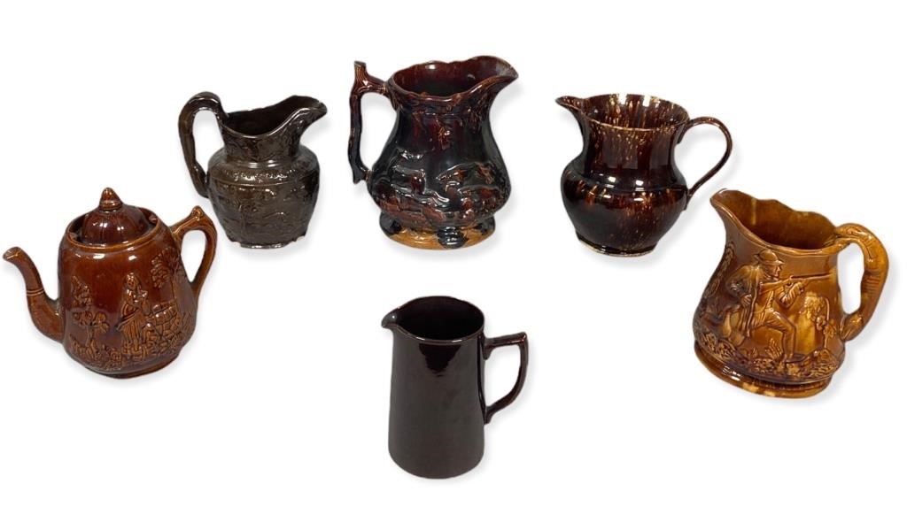 Appraisal: PIECES OF BENNINGTON BROWN POTTERYCollection of brown pottery jugs including