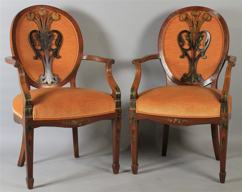 Appraisal: PAIR OF EDWARDIAN MAHOGANY CARVED AND PAINT DECORATED OPEN ARM