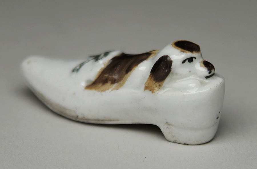 Appraisal: INTERESTING PORCELAIN FIGURAL WHISTLE In the shape of a ladies