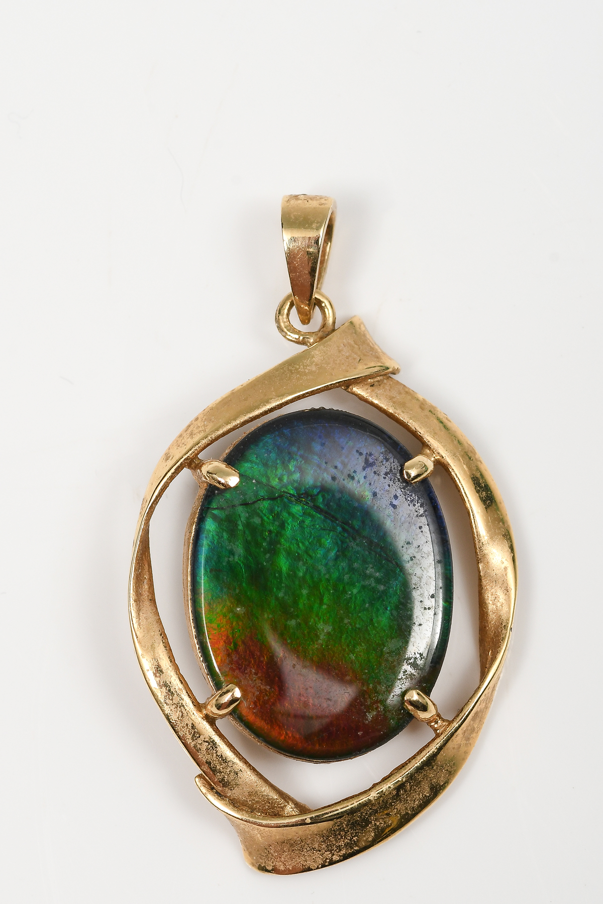 Appraisal: K AMMOLITE PENDANT K yellow gold pendant contains one oval