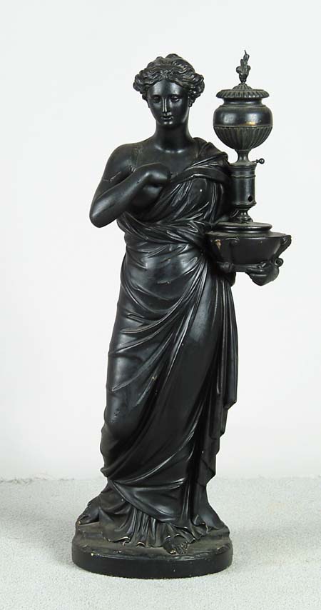 Appraisal: PLASTER FIGURE OF A WOMAN Painted black she holds a