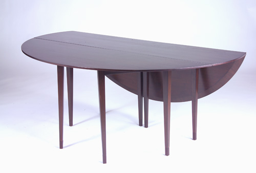 Appraisal: EDWARD WORMLEY DUNBAR Drop-leaf dining table with oval top and