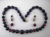 Appraisal: A graduated sapphire and ruby bead necklace approx cm together