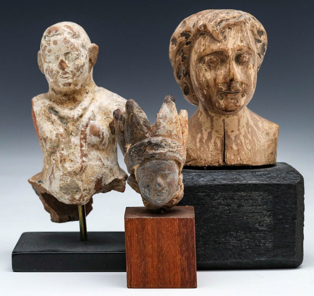 Appraisal: A COLLECTION OF EARLY CARVED WOOD SCULPTURE FRAGMENTS Wood and