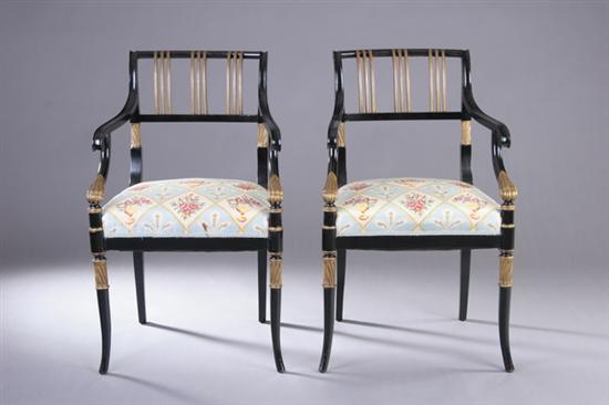 Appraisal: PAIR REGENCY PARCEL-GILT AND EBONIZED ARMCHAIRS th century Back-scrolled crest