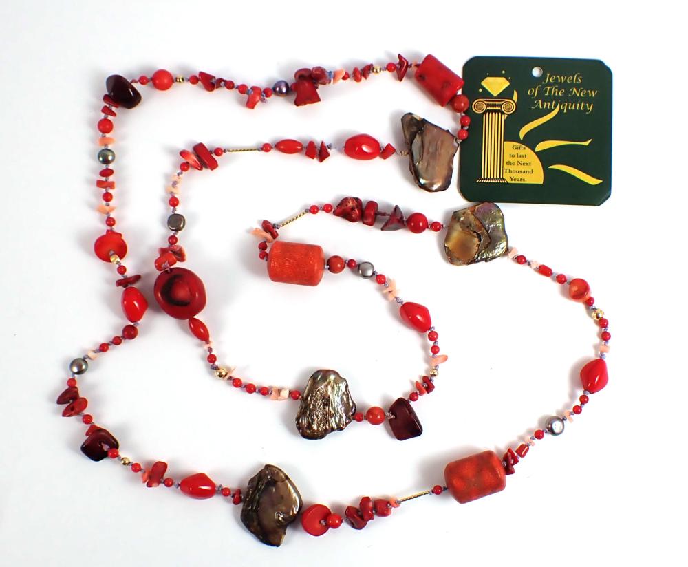 Appraisal: CORAL PEARL AND FOURTEEN KARAT GOLD NECKLACE hand-knotted strand with