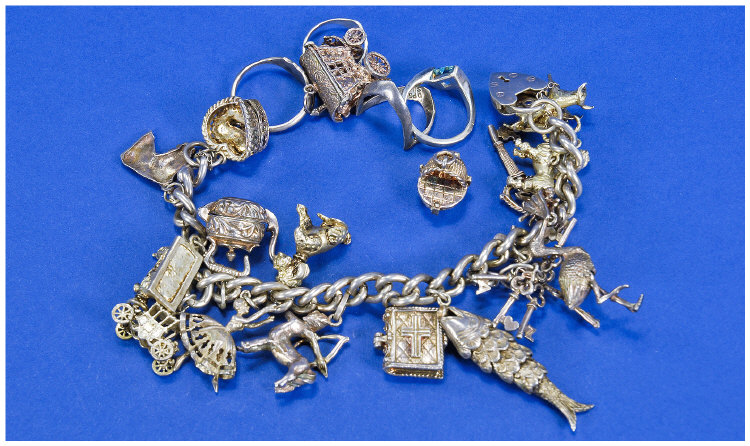 Appraisal: Silver Charm Bracelet Loaded With Charms Comprising Fish Keys Bible