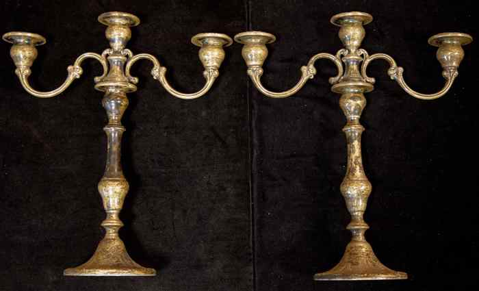 Appraisal: PAIR OF GORHAM SILVER THREE-LIGHT CANDLESTICKS With circular spreading bases