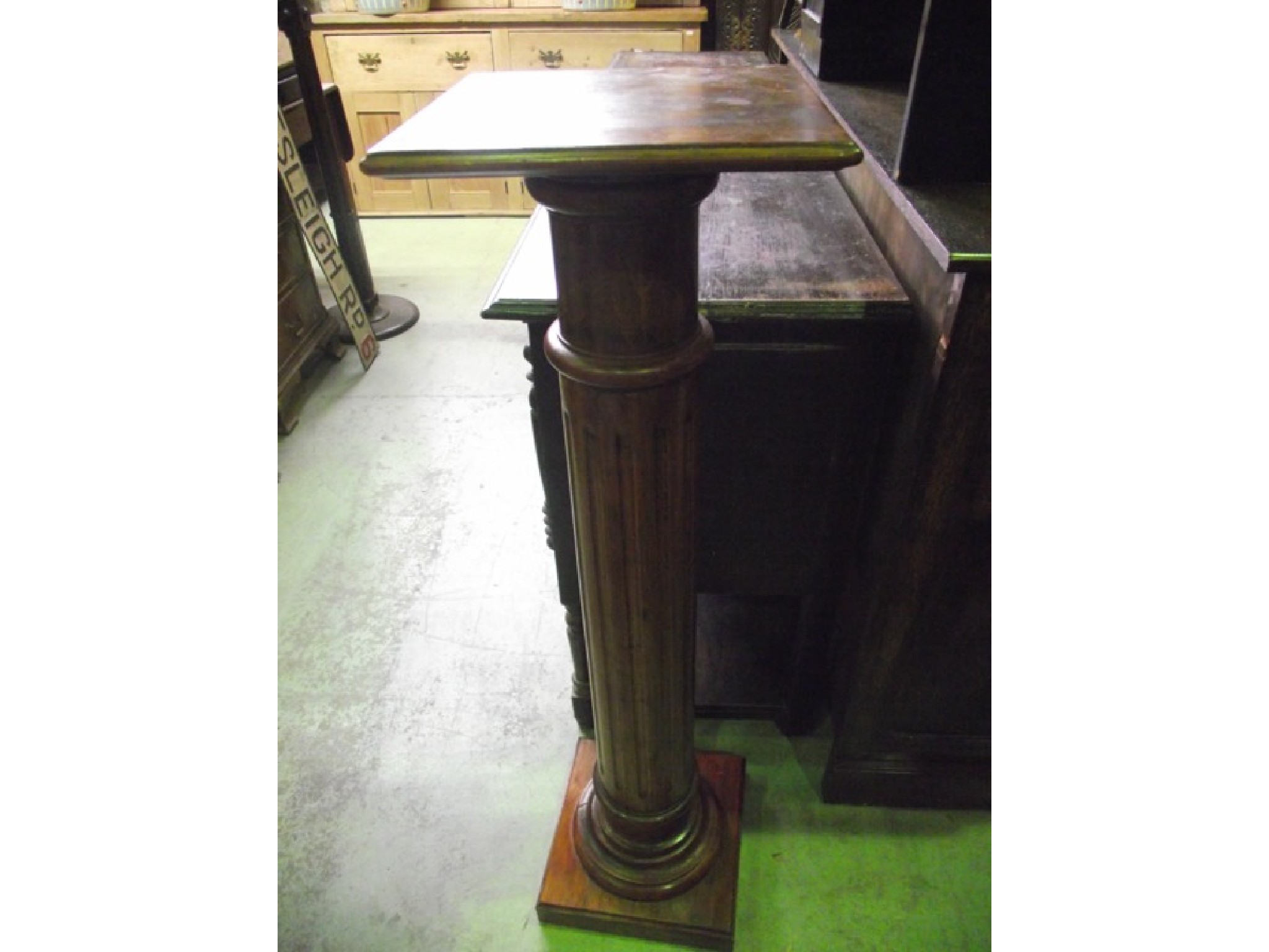 Appraisal: A stained pine and beechwood torchere with turned and fluted