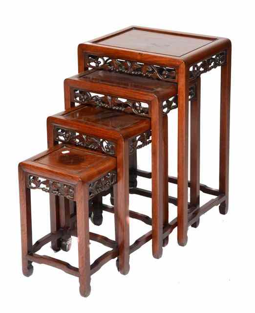 Appraisal: A QUARTETTO OF CHINESE CHERRY WOOD TABLES of graduated rectangular