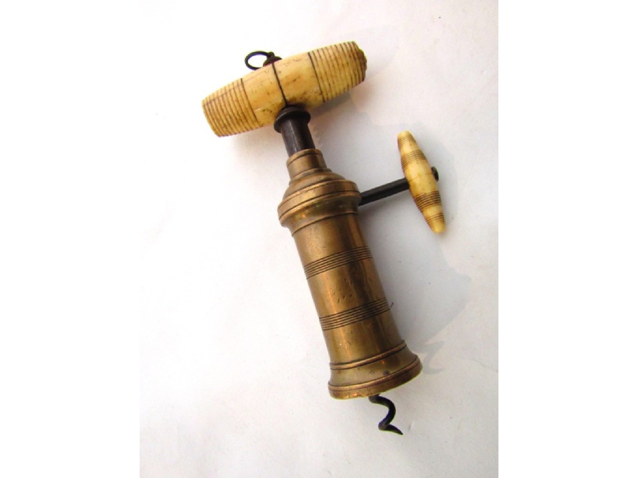 Appraisal: A Thomson type mechanical corkscrew with brass body steel ratchet