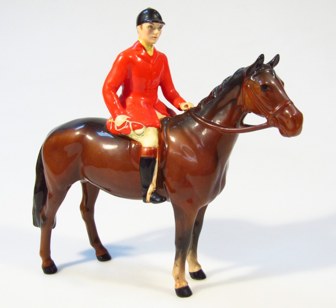 Appraisal: A Beswick figure of a red jacketed huntsman on brown