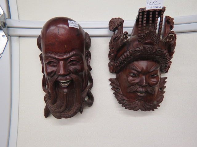 Appraisal: Oriental Carved Wooden Masks one with dragons on helmet other