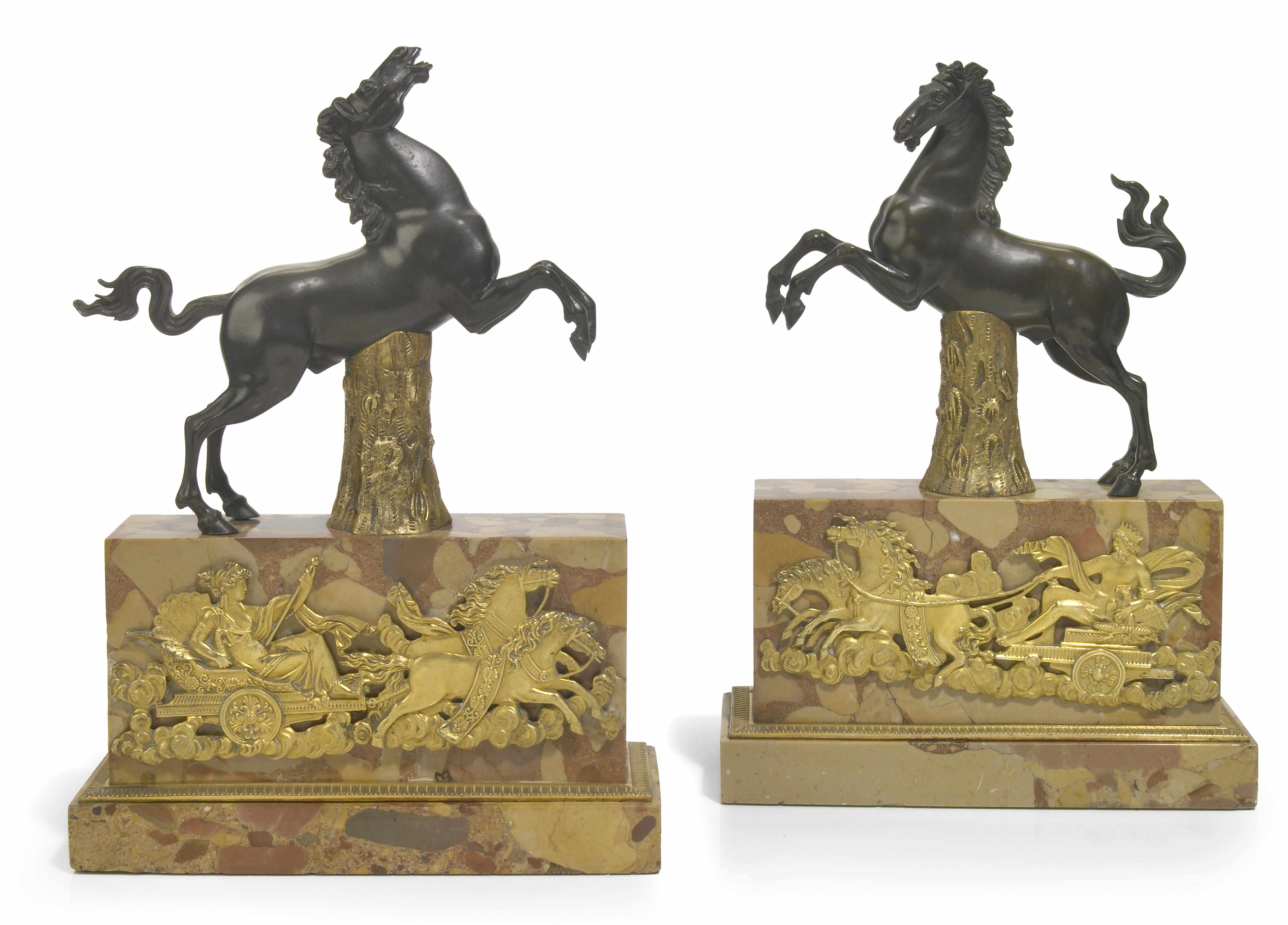 Appraisal: A pair of Continental patinated and gilt bronze marble bookends