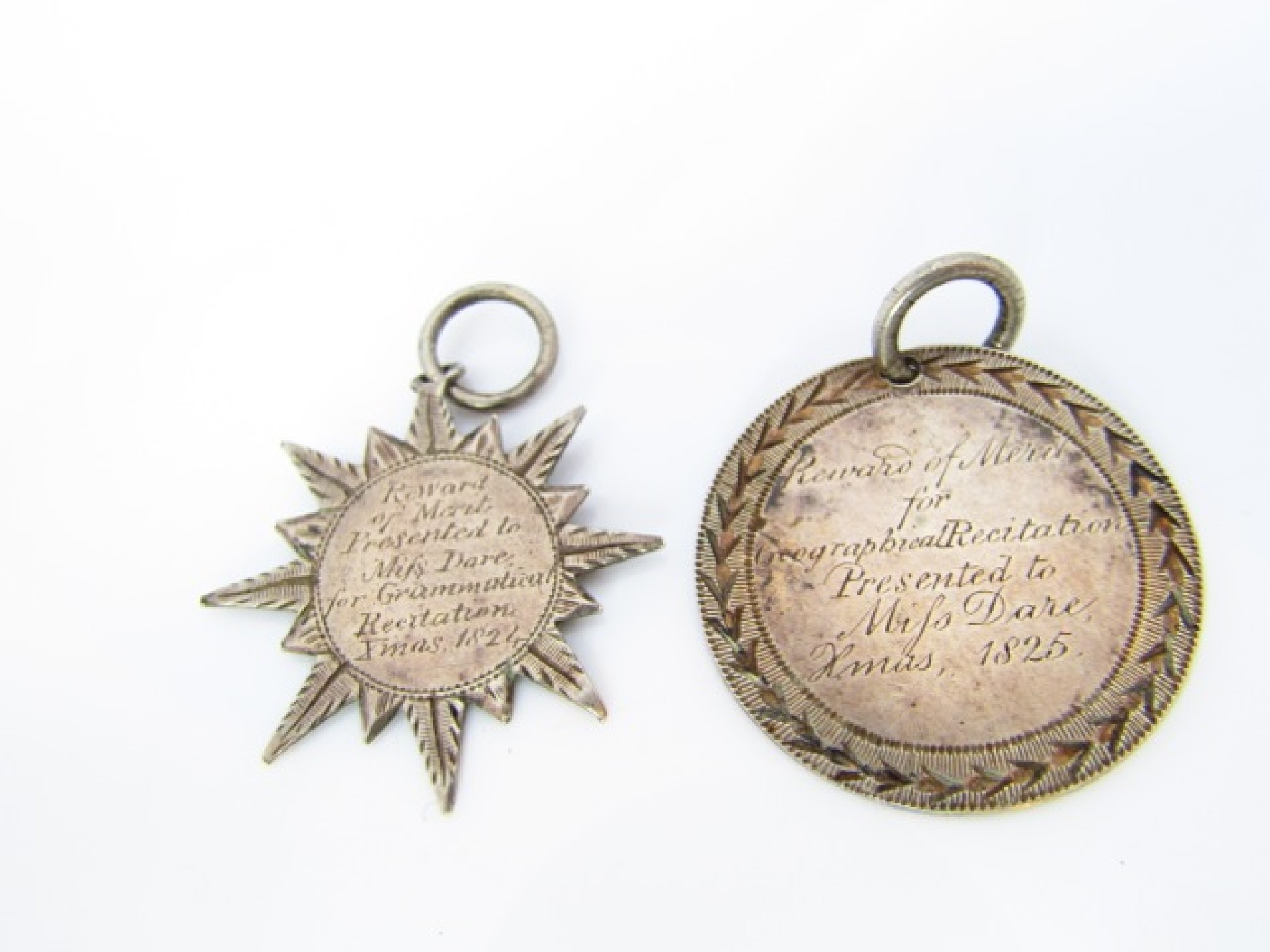 Appraisal: Two George IV silver reward of merit medals to Miss