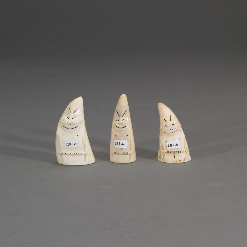 Appraisal: Unidentified THREE BILLIKINS whale or walrus tooth height x width