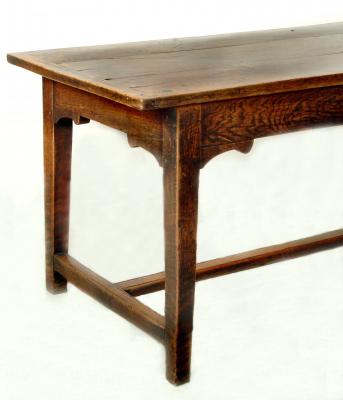 Appraisal: AN OAK REFECTORY STYLE TABLE the three plank top and