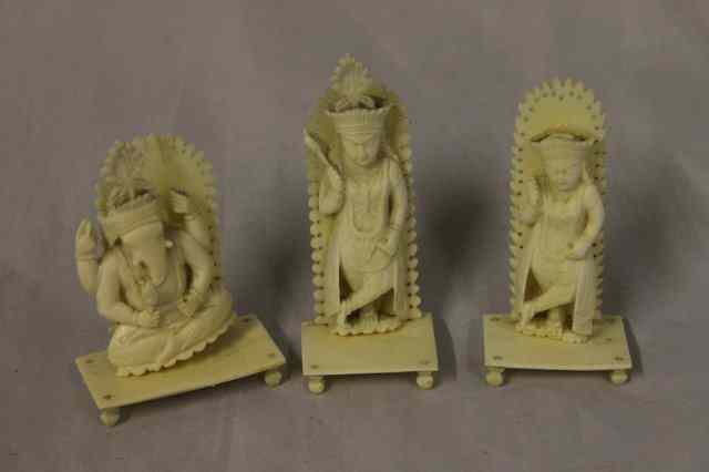 Appraisal: THREE CARVED INDIAN SMALL DEITIES