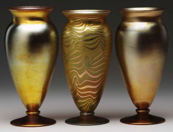 Appraisal: DURAND Three iridescent footed vases two gold one with gold