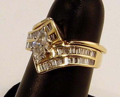 Appraisal: MARQUISE DIAMOND BYPASS BRIDAL RING SET K yellow gold wedding