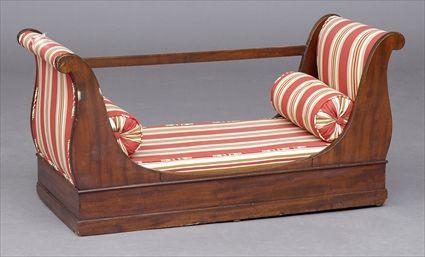 Appraisal: EMPIRE MAHOGANY CHILD'S DAYBED The s-scroll padded ends joined at