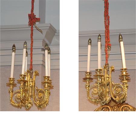 Appraisal: Pair of Empire Style Gilt-Metal Five-Light Chandeliers Estimate -