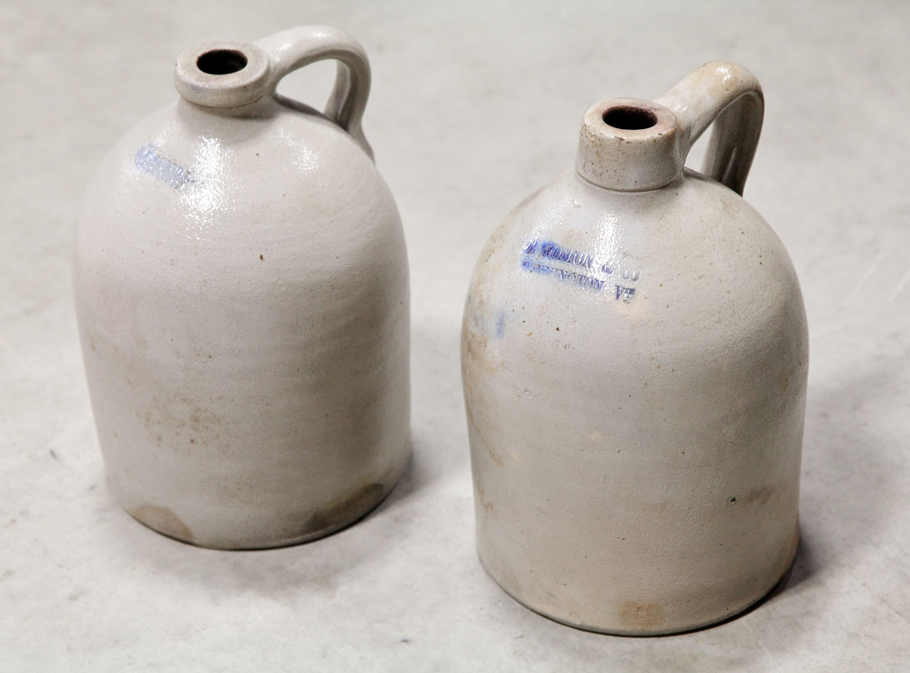 Appraisal: TWO NORTON STONEWARE JUGS Bennington Vermont th century Similar forms