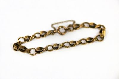 Appraisal: A ct yellow gold fancy link bracelet with safety chain