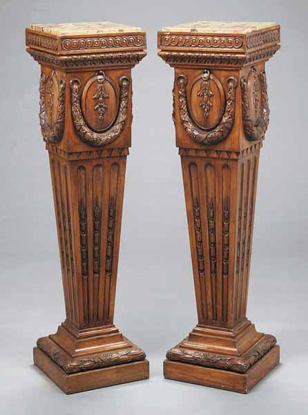 Appraisal: A Pair of Neo-Classical-Style Fruitwood Pedestals finely carved the vitruvian