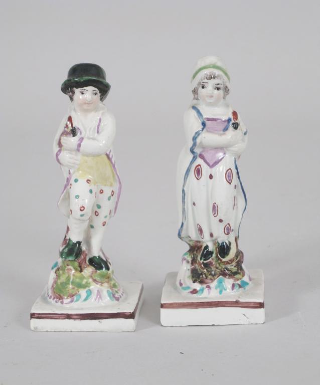 Appraisal: Pair of early th Century Staffordshire pearlware Figures of boy