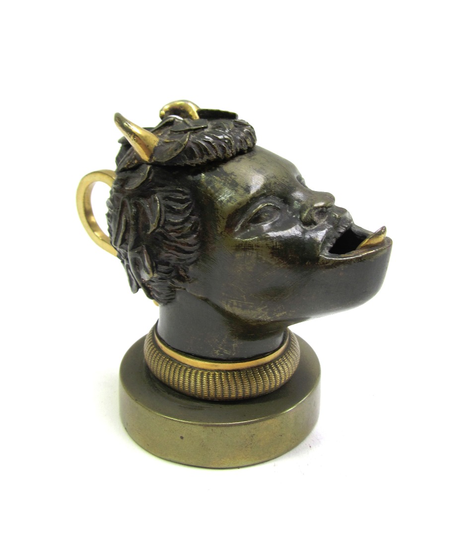 Appraisal: An unusual gilt and patinated bronze figural inkwell th century