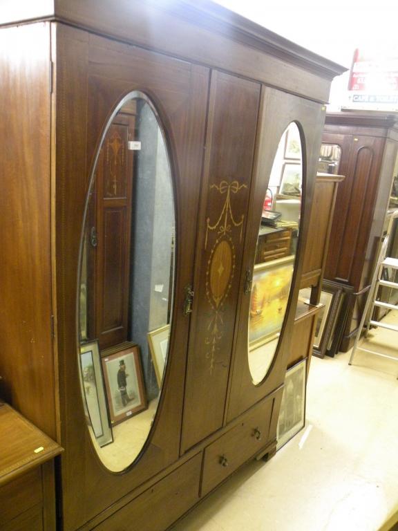 Appraisal: An Edwardian mahogany and marquetry wardrobe the two doors each