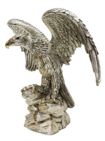 Appraisal: Large sterling silver over resin sculpture Eagle on a Rocky